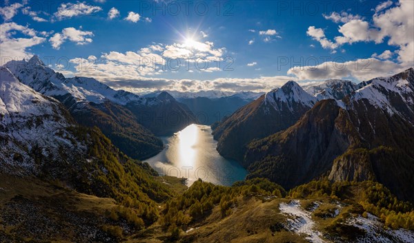 Aerial view over the autumnal forest at Lago di Luzzone in Valle di Blenio