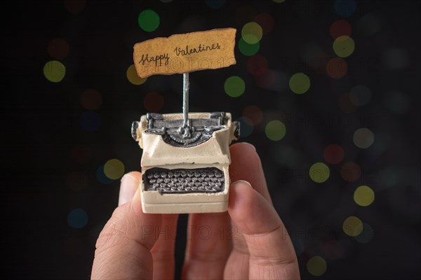 Valentine's day wording on torn typewriter as Love concept