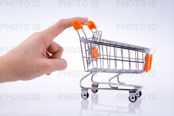 Hand holding a Cart on a white background