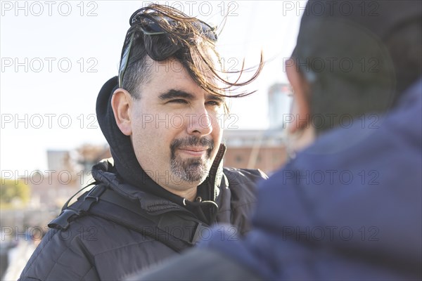 Gay latin male couple looking into each other's eyes