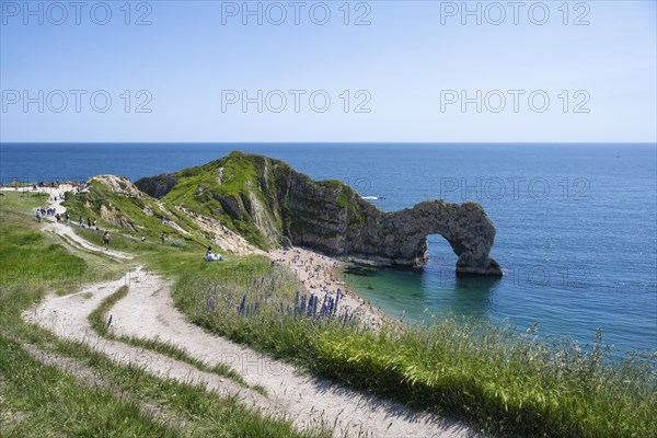 Walk along the chalk coast with the famous rock bridge Durdledoor