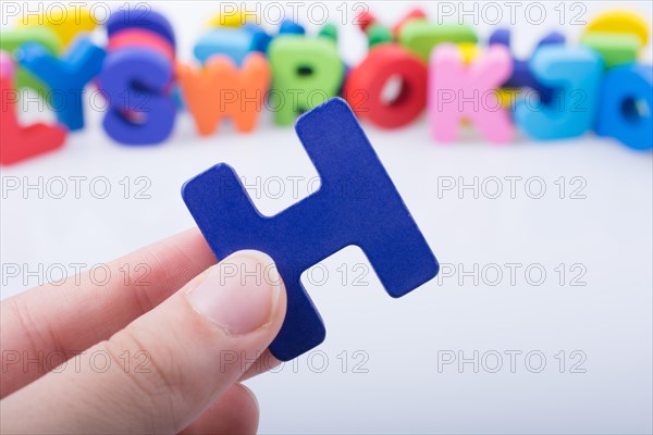 Letter cube of H of Alphabet made of wood