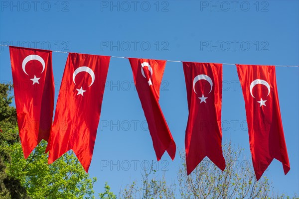 Turkish national flag hang in view in open air