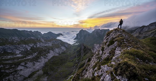 View over Saentis mountains into the valley of Meglisalp at sunrise