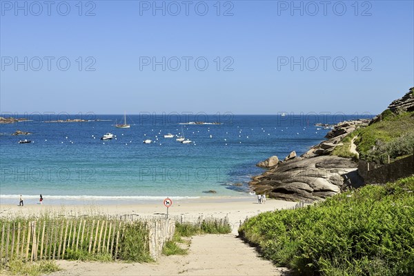 Bay with sandy beach and granite rocks