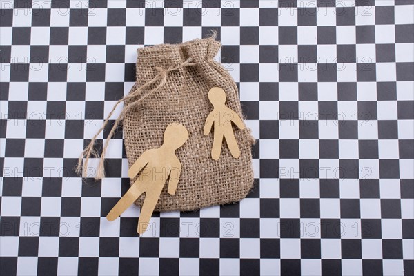 Man shape cut out of paper on canvas sack
