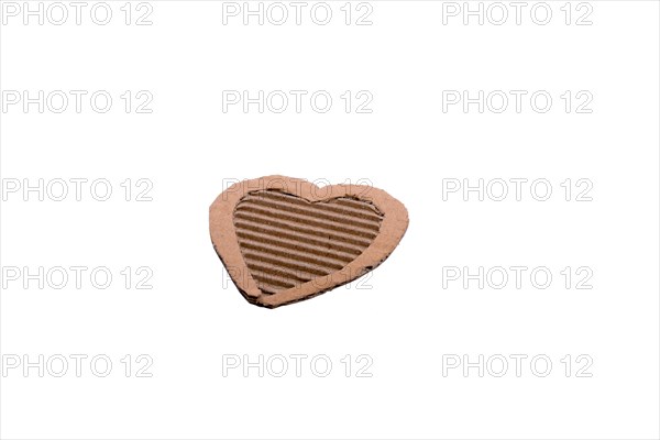 Heart shape cut out of a cardboard paper