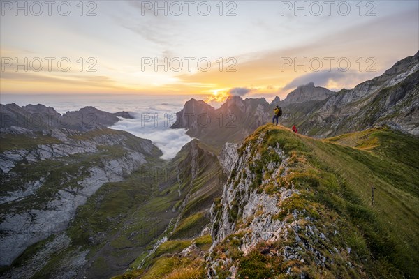 Mountaineer at sunrise on the Rotstein Pass