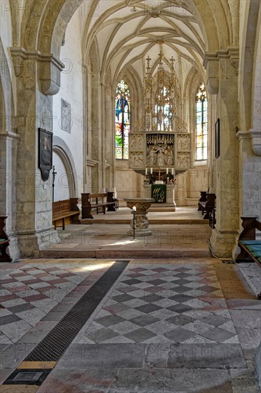 Gothic choir room with altar and baptismal font