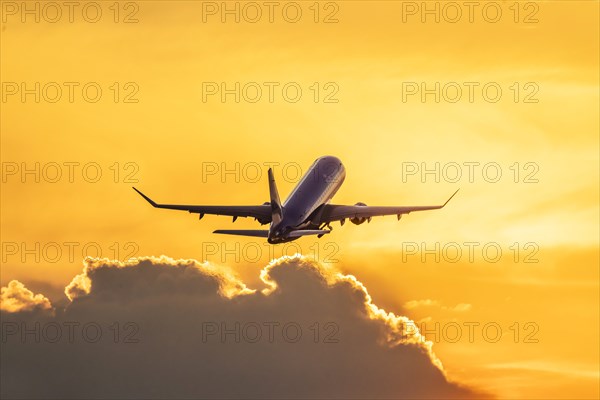 Aircraft takes off into the dawn at Stuttgart Airport