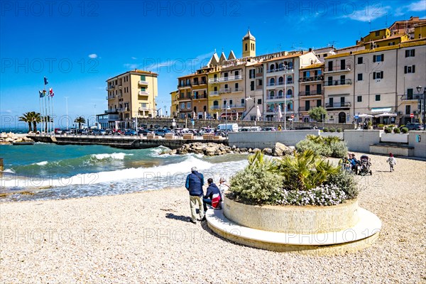 Artificial pebble beach in the old harbour of Porto Santo Stefano