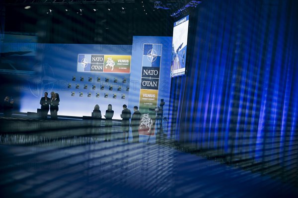 NATO's logo reflected in a disc at the NATO summit in Vilnius