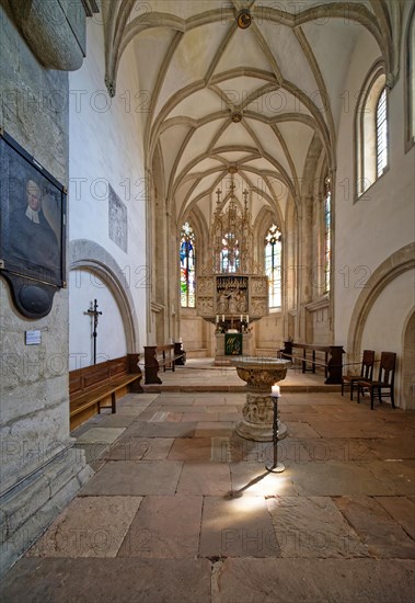 Gothic choir room with altar and baptismal font