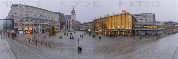 Church of St. Mary's Assumption and main railway station with station forecourt