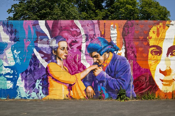 Brightly coloured graffiti on Lottehaus with Charlotte Buff and Johann Wolfgang von Goethe