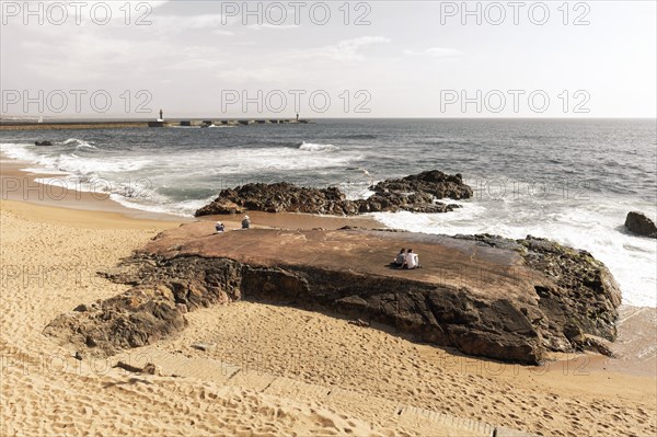 Sandy beach beach with granite rocks at the Douro estuary