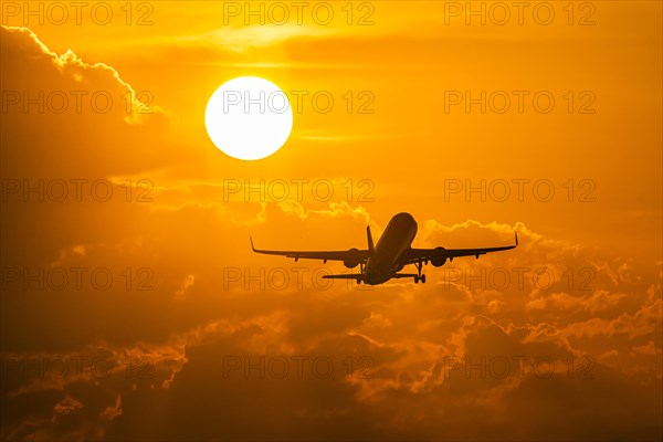 Aircraft takes off into the dawn at Stuttgart Airport