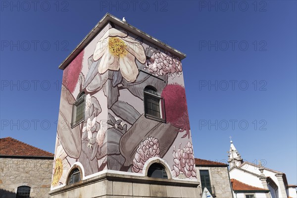 Transformer house painted with flower and plant motifs