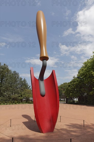 Oversized red planting shovel