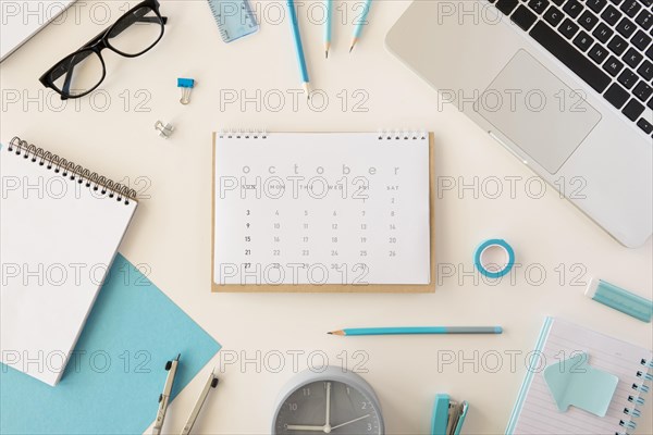 Flat lay desk calendar blue office accessories
