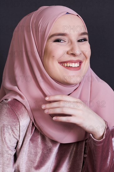 Front view laughing woman black backdrop