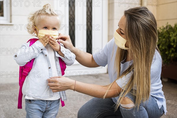 Mother child with medical masks