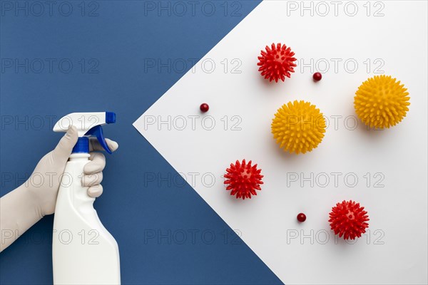 Flat lay hand holding disinfectant against viruses