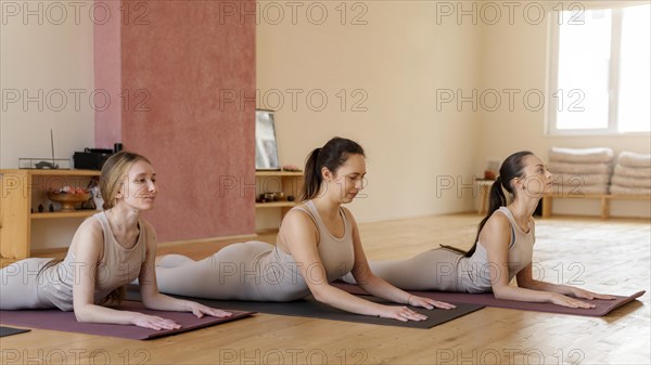 Yoga teacher teaching class9