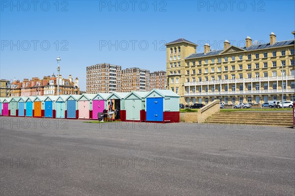 Row of beautiful colourful seaside bathing cottages in Brighton and Hove