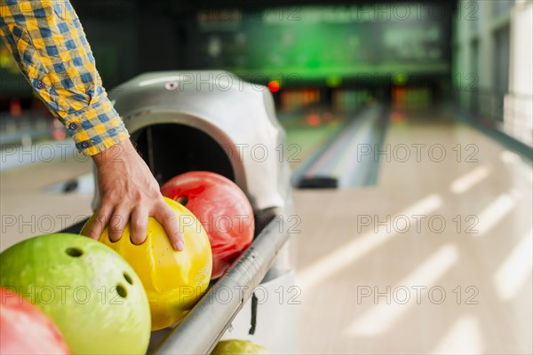 Person taking bowling ball