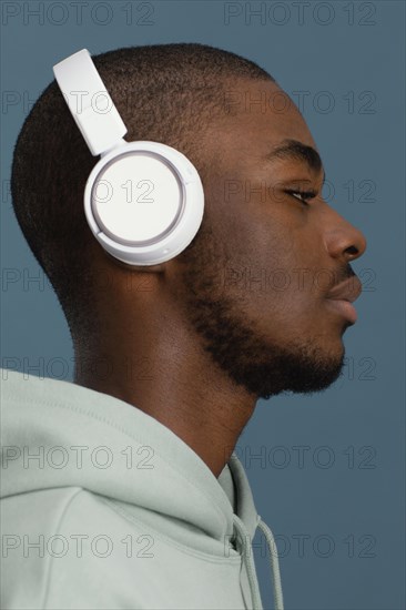 Side view handsome man with headphones