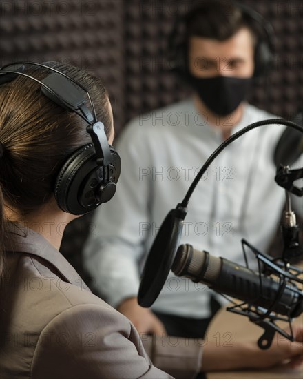 Close up people wearing mask radio