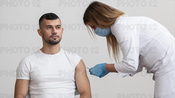 Doctor vaccinating patient