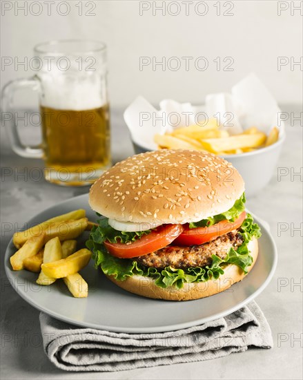 High angle close up burger with fries plate
