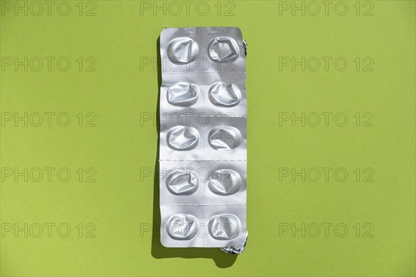 Empty tablet blister pack against a monochrome background