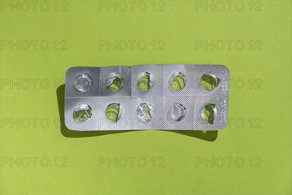 Empty tablet blister pack against a monochrome background