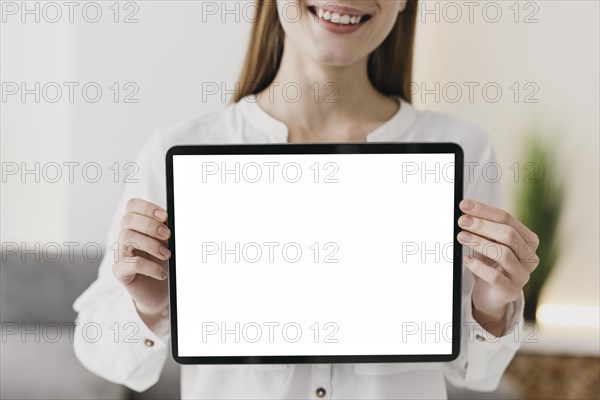 Front view teacher holding copy space digital tablet