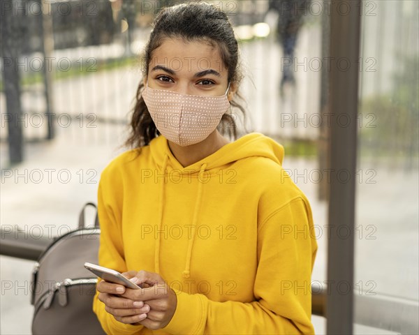 Front view girl with face mask street
