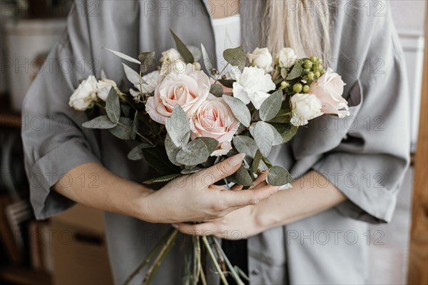 Female florist making beautiful floral arrangement