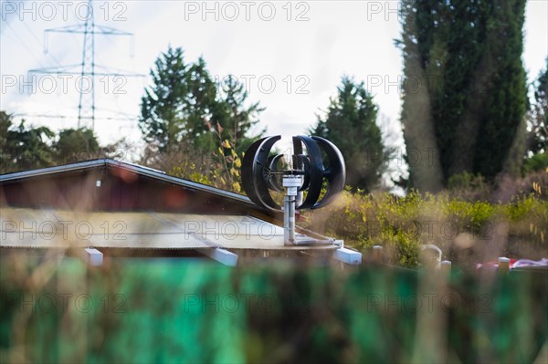 Small wind turbine on a roof of an allotment house in Duesseldorf