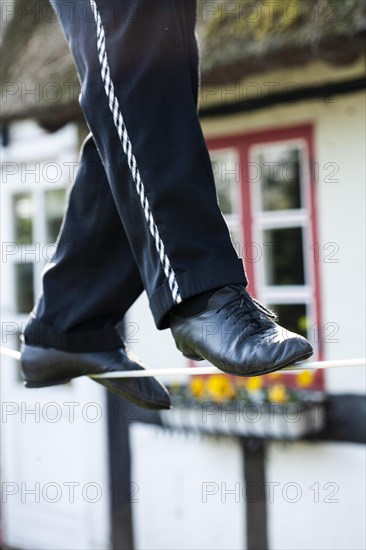 An artist on a tightrope