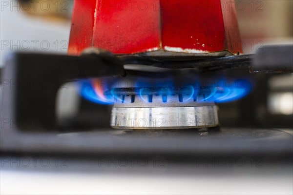 Espresso maker over a flame on a gas cooker