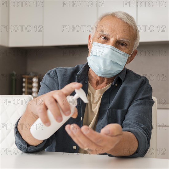 Front view man with mask disinfectant