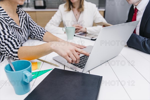 Woman showing information laptop