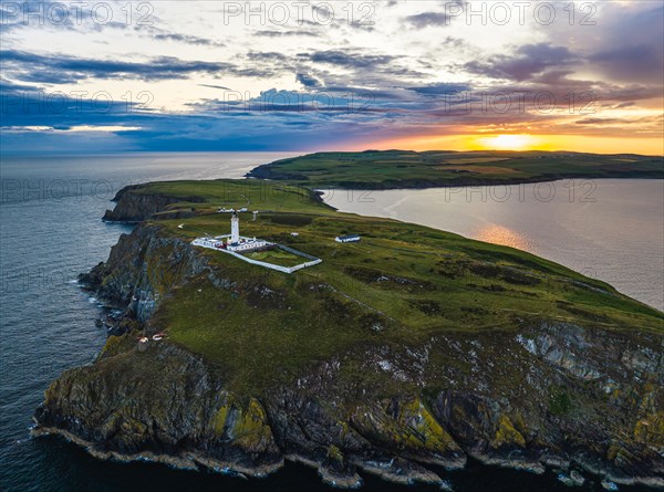 Sunset over Mull of Galloway Lighthouse from a drone