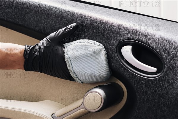 Person cleaning car interior