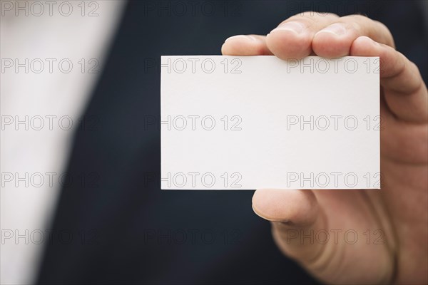 Close up visiting card hand