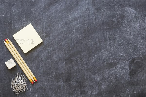 Empty blackboard with stationery