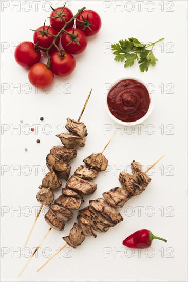 Top view delicious kebab with tomatoes ketchup
