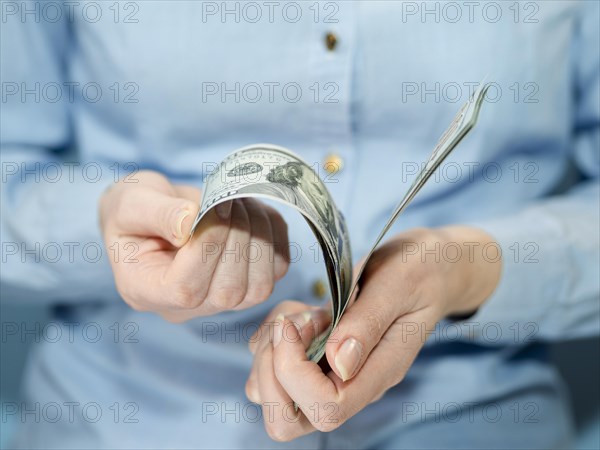 Front view person holding money